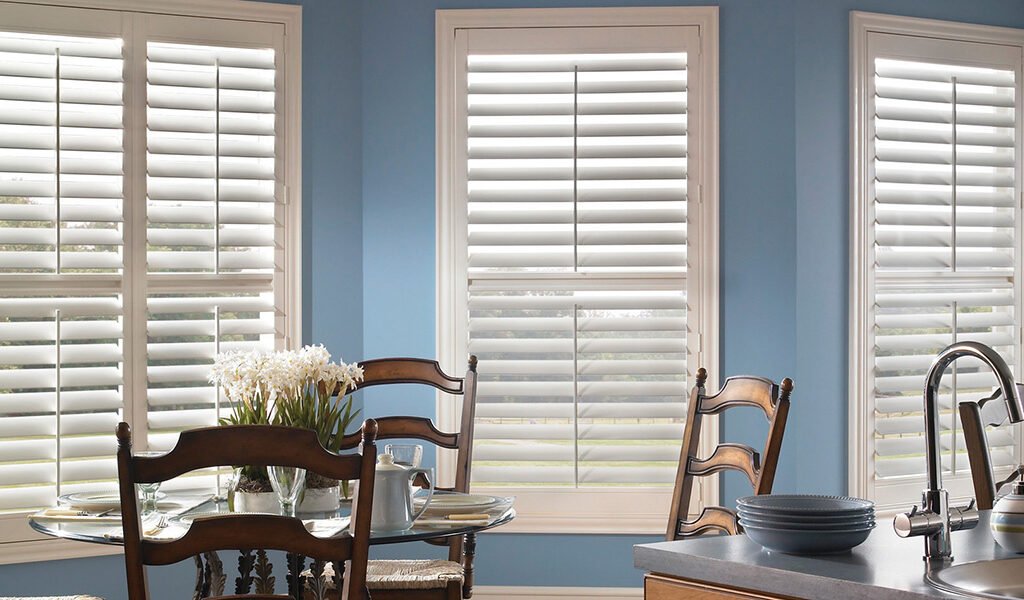 White Eclipse Blinds & Shutters in light blue dining room - Paul James Blinds