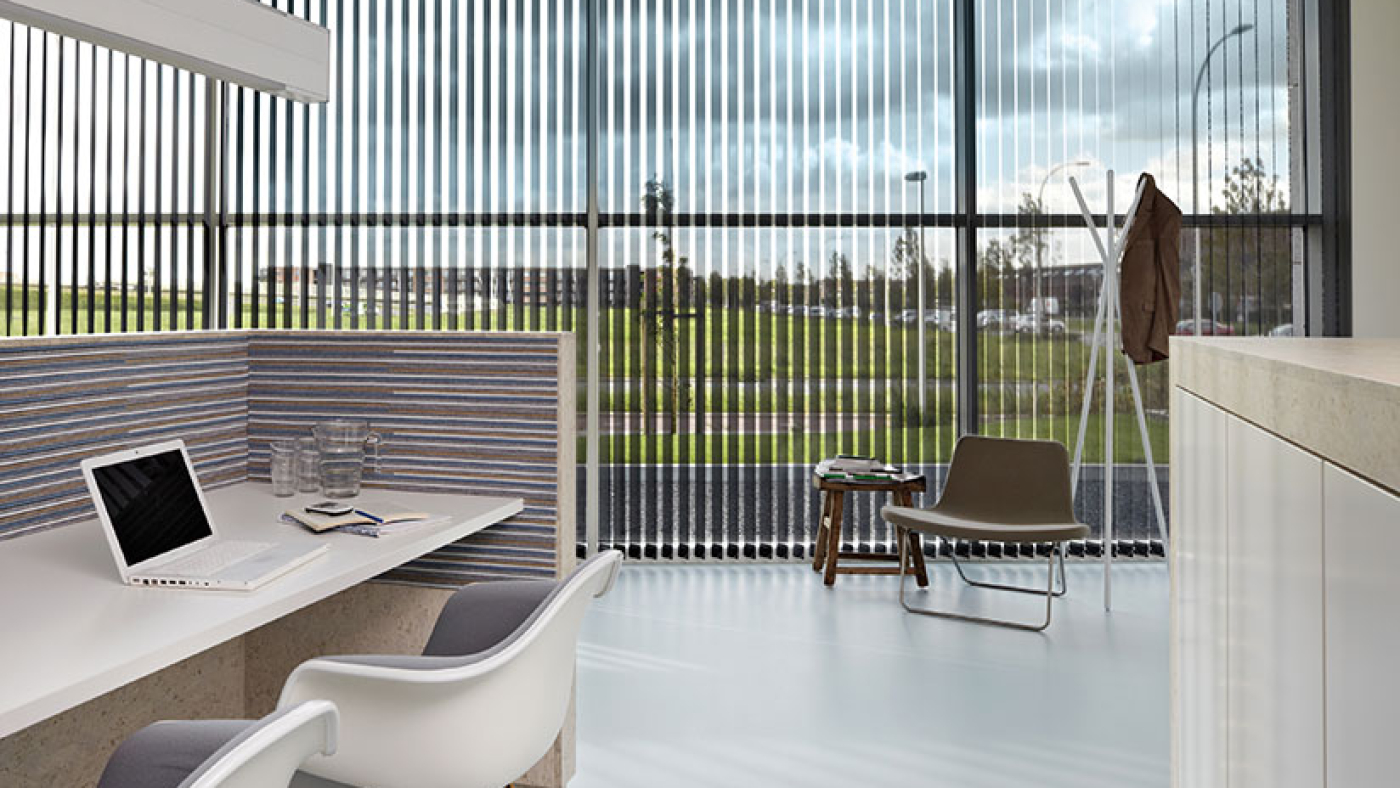 Silver/see through blinds in a modern office