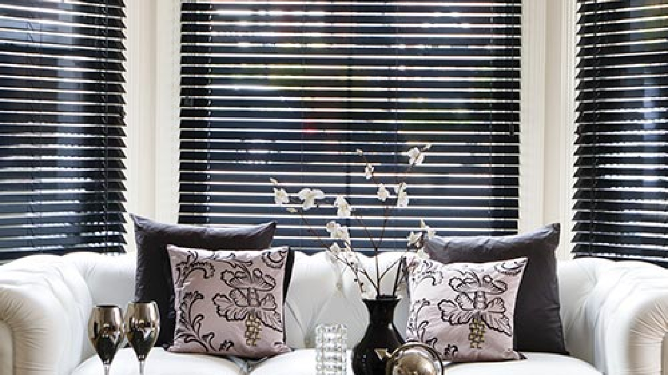 white sofa with bay windows in background